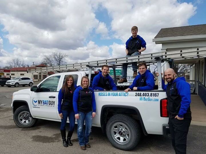 my bat guy team photo in front of service truck